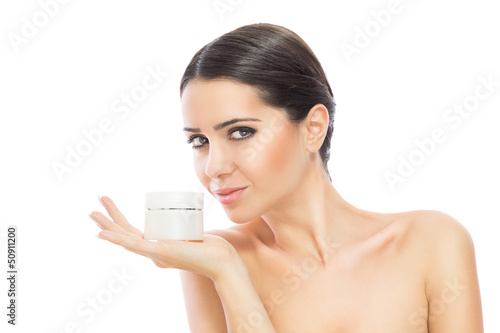 Photo: Gorgeous woman holding skin cream Gorgeous woman holding skin cream