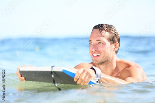 Photo: Beach fun - man bodyboarding on bodyboard Beach fun - man bodyboarding on bodyboard
