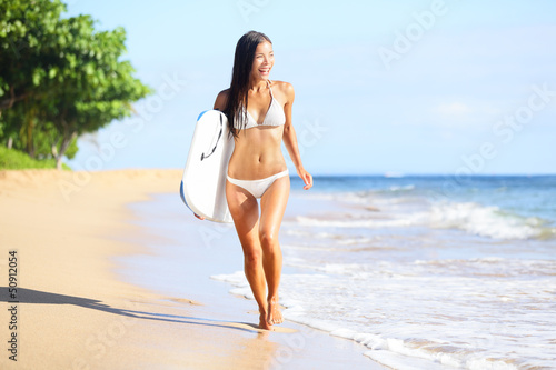 Photo: Beach woman fun with body surfboard Beach woman fun with body surfboard