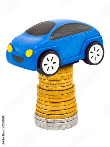 Photo: Toy car and stack of coins Toy car and stack of coins
