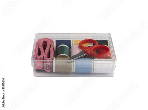 Photo: Set of sewing in the plastic box isolated on white background Set of sewing in the plastic box isolated on white background
