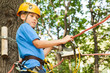 Young guy with climber equipment focused  for moving.