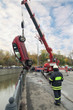 Photo: Large red rescue vehicle helps injured in car crash. Large red rescue vehicle helps injured in car crash.