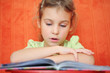Photo: The girl reads the book focuses The girl reads the book focuses