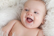 Photo: Portrait of a smiling baby close-up. Eyes in the direction of. Portrait of a smiling baby close-up. Eyes in the direction of.