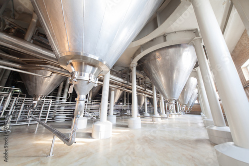 Photo: Equipment for the brewery. Large tanks and shiny tubes. Equipment for the brewery. Large tanks and shiny tubes.