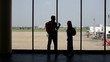 Video: silhouette of pair of lovers near the window in airport silhouette of pair of lovers near the window in airport