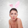 Photo: woman wearing cute bunny sending a kiss woman wearing cute bunny sending a kiss