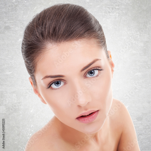 Photo: young woman's face with healthy clean skin young woman's face with healthy clean skin