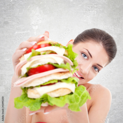 Photo: woman giving us a huge sandwich woman giving us a huge sandwich