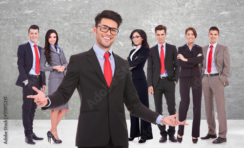 Photo: business man welcoming you to his successful team business man welcoming you to his successful team