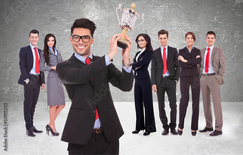 Photo: businssteam rewarded for it's work with trophy businssteam rewarded for it's work with trophy