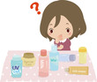 たくさんのスキンケア用品を見て悩む女性
