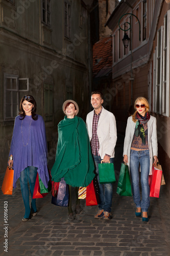 Photo: young people walking with shopping bags young people walking with shopping bags