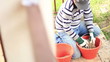 Man prepares seed and fertilizer for sowing