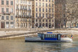 Photo: petit bateau bus sur la saone à lyon près des quais petit bateau bus sur la saone à lyon près des quais