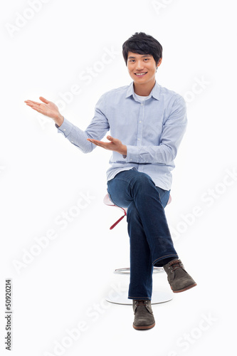 Photo: Asian man present something Asian man present something