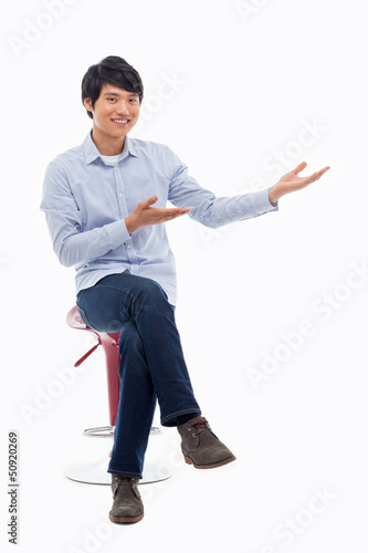 Photo: Asian man present something Asian man present something
