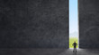 man looking at opened concrete wall