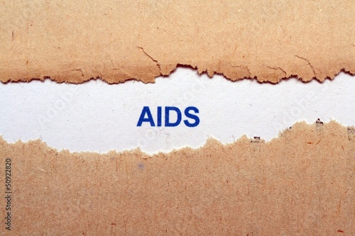 Photo: Aids text on torn paper Aids text on torn paper