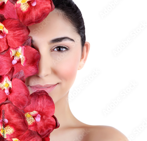 Photo: Woman with orchid flowers on face Woman with orchid flowers on face