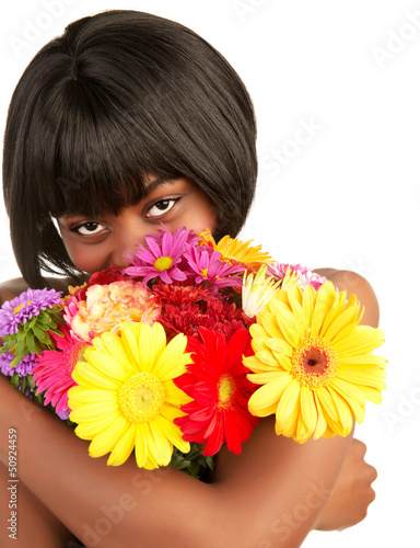 Photo: Black female smelling flowers Black female smelling flowers