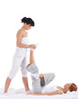 A young redhead woman on a Thai massage procedure