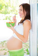 Pregnant woman eating salad