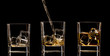 Whiskey glasses with splash, isolated on black background