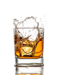 Whiskey glass with splash, isolated on white background
