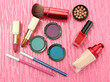 Decorative cosmetics on pink background