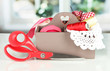 Box with the materials at hand sewing on bright background