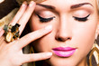 beautiful face of young woman with fashion makeup
