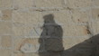 Shadow fighting brick wall