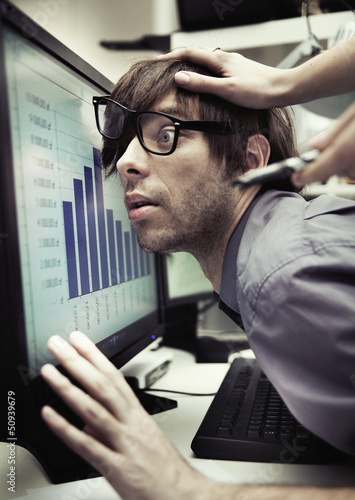 Photo: Office worker forced to work harder Office worker forced to work harder