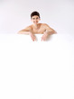 Smiling teenager with big white board