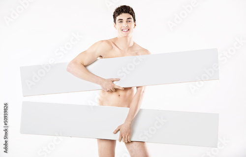 Photo: Young athlete man holding two boards Young athlete man holding two boards