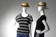 Two Fashion female clothing in hat on mannequin
