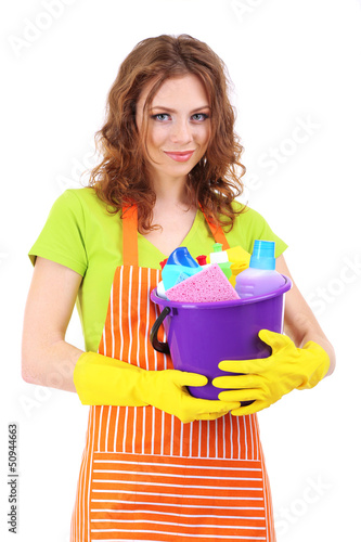 Photo: Young housewife with bucket of cleaning supplies, isolated Young housewife with bucket of cleaning supplies, isolated