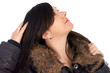 Foto: Woman in winter jacket lokking to sky Woman in winter jacket lokking to sky