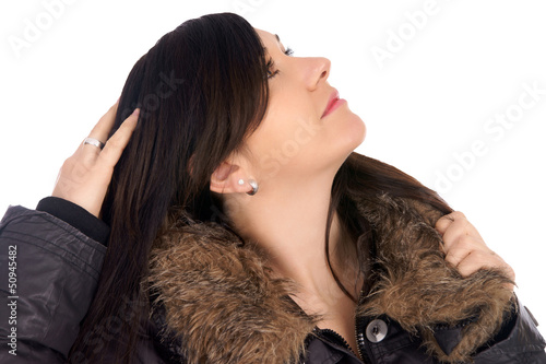 Photo: Woman in winter jacket lokking to sky Woman in winter jacket lokking to sky