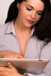 Young professional female using tablet device iPad