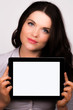 Young female presenting ipad tablet device screen