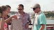 Friends checking shoppings in city, super slow motion