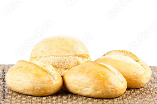Photo: Bread on a white background. delicious buns isolated on white Bread on a white background. delicious buns isolated on white