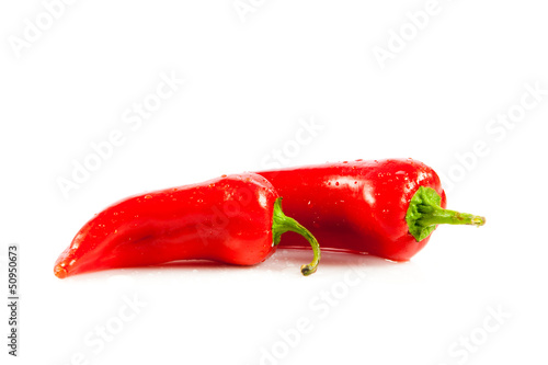 Photo: Red hot chili peppers on white background. Red hot chili peppers on white background.