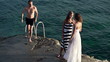 Friends having fun by the lake, super slow motion