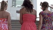 Three happy female friends in the city