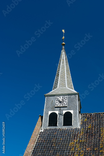 Photo: Dutch church tower with clock Dutch church tower with clock