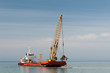 Dredger lifts Mud from Harbor